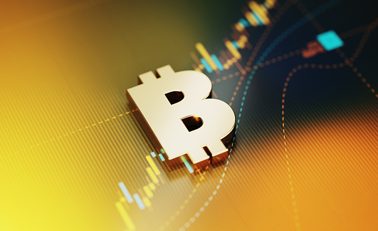 Concepto de inversión y finanzas - Símbolo bitcoin sentado en el fondo del gráfico financiero amarillo photo