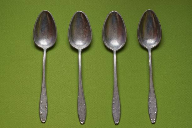 istock dishes made of four old aluminum spoons 1312256474