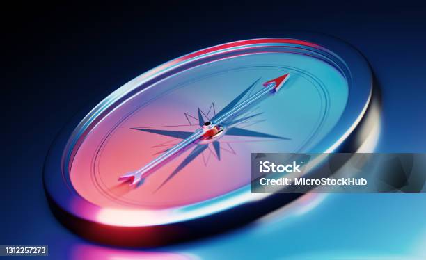 Compass Sitting Over Metallic Dark Blue Background Stock Photo - Download Image Now - Navigational Compass, Direction, Abstract