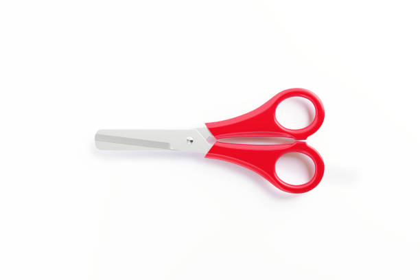 Red scissor sitting over white background. Horizontal composition with copy space.