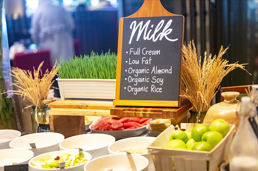 Organic food bar with sign for milk
