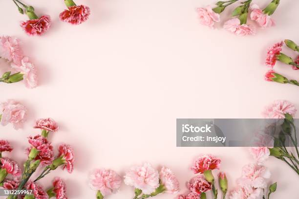 Design Concept Of Mothers Day Holiday Greeting With Carnation Bouquet On Pink Table Background Stock Photo - Download Image Now