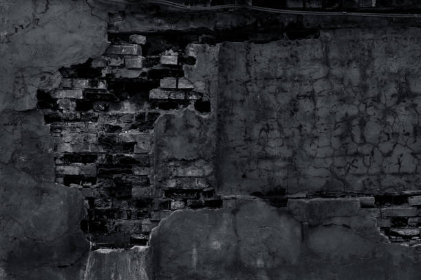 istock A gloomy dark old wall with fragments of brickwork 1312260079