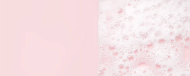 istock White foam bubbles texture on pink pastel background, copy space, banner for loundry, cleaning service, bathroom concept, clean, wash - liquid soap, shower gel, shampoo 1312260363