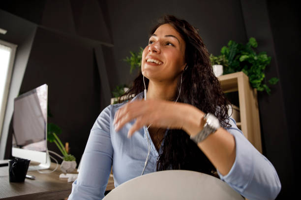 istock Cheerful businesswoman gesturing with hands during a video conference 1312264858