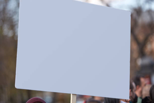 istock Protesters holding placards and signs on the streets. 1312265172