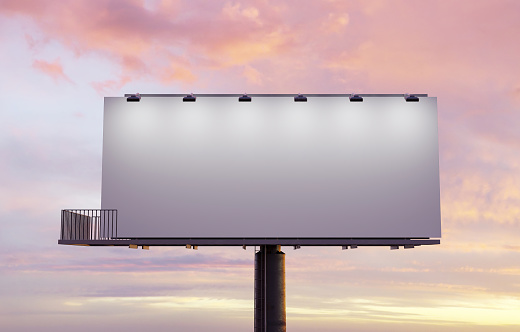 mockup of a street billboard illuminated with spotlights and sunset. 3d rendering