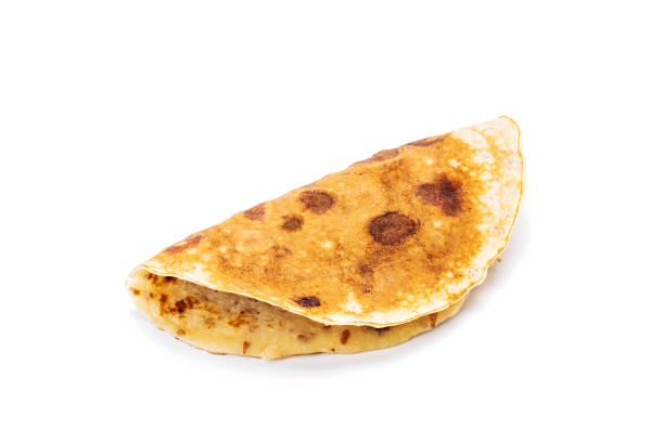 istock pancake isolated on white background. slapjack with cranberry cut out 1312266304