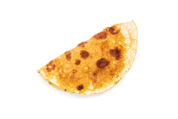 istock pancake isolated on white background. slapjack with cranberry cut out 1312266393