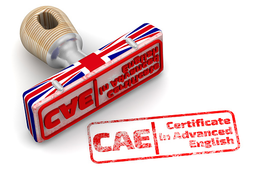 Rubber stamp in colors of the UK flag and red imprint CAE. Certificate in Advanced English on white surface. 3D illustration