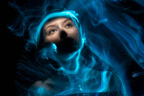istock lightpainting portrait, long exposure 1312269619