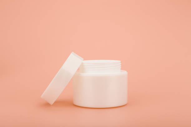 istock White glossy opened cream jar on beige background with copy space 1312269841