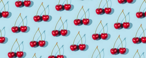 istock A ripe cherry berries on a blue background. 1312271231
