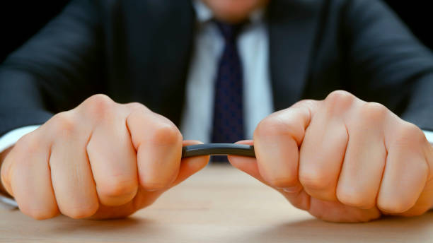 istock Male hands breaking pencil 1312271384