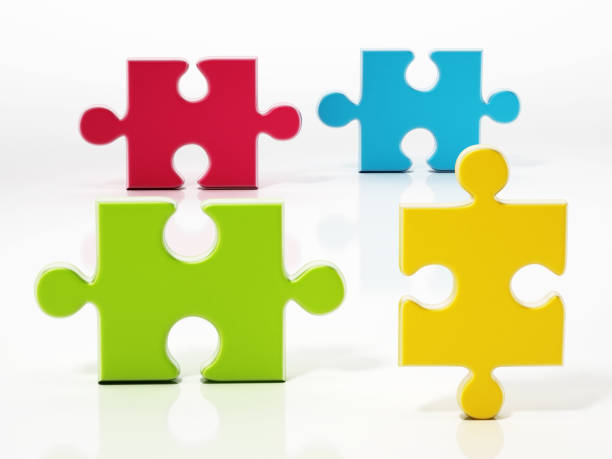istock Four colored fitting puzzle pieces isolated on white 1312272304