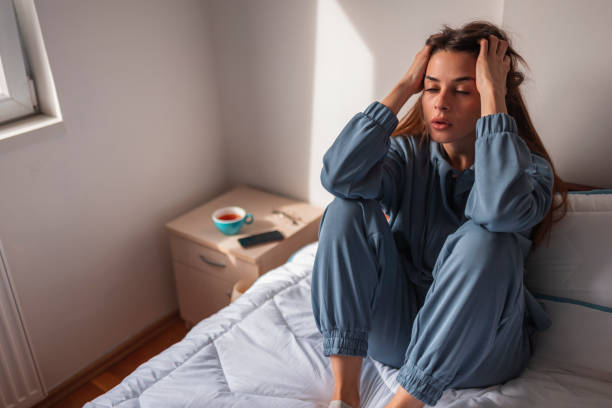 istock Stressed out woman holding head in hands depressed 1312272688