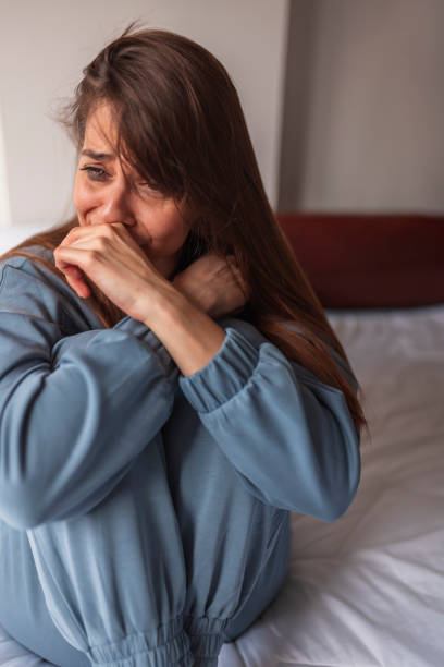 istock Sad woman sobbing in bed 1312272699