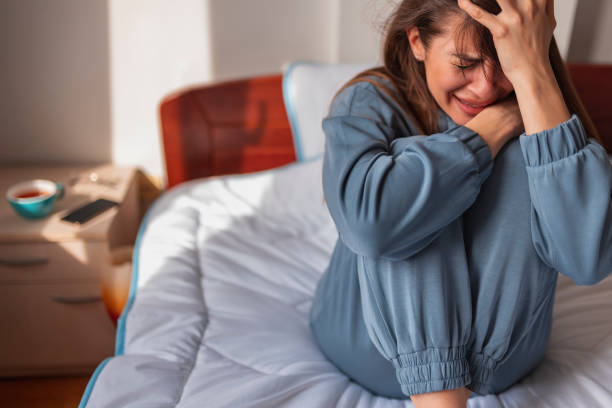 istock Anxious woman crying in bed 1312272719