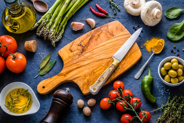 istock Cutting board surrounded by healthy fresh vegetables 1312273352