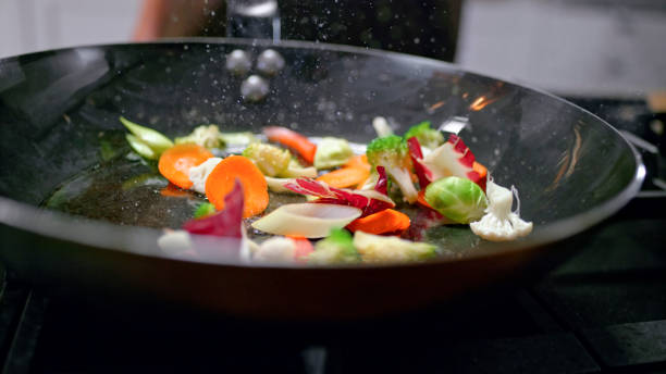 istock Fresh vegetables in frying pan 1312275137