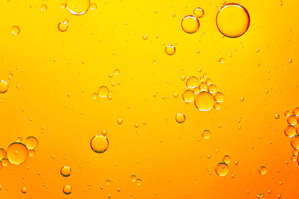 istock oil with bubbles on on dark blue background. Abstract background. 1312275174