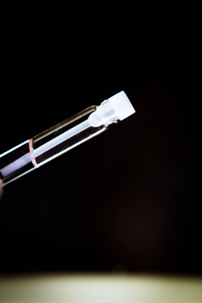 istock Perfume sample in a small clear glass bottle. Copy space 1312276206