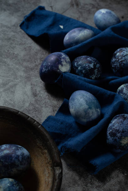istock marble eggs on blue towel and old concrete background 1312276781