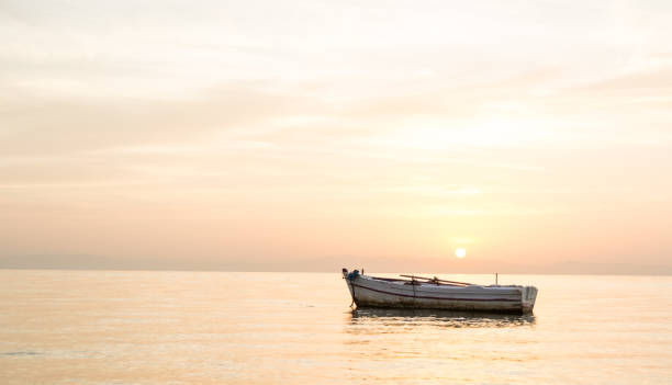 istock row boat with sunrise view 1312276852