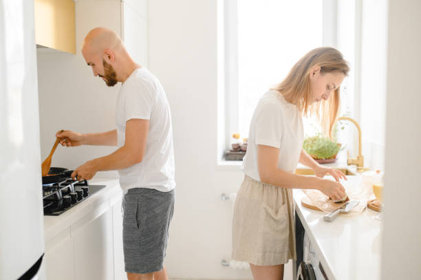 istock husband and wife cooking in the kitchen 1312277755