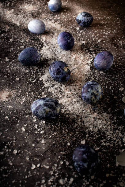 istock Outer space and milky way galaxy concept. Still life of salt and eggs on a concrete background. Marble Easter eggs are laid out on salt in the form of a nebula. 1312280186