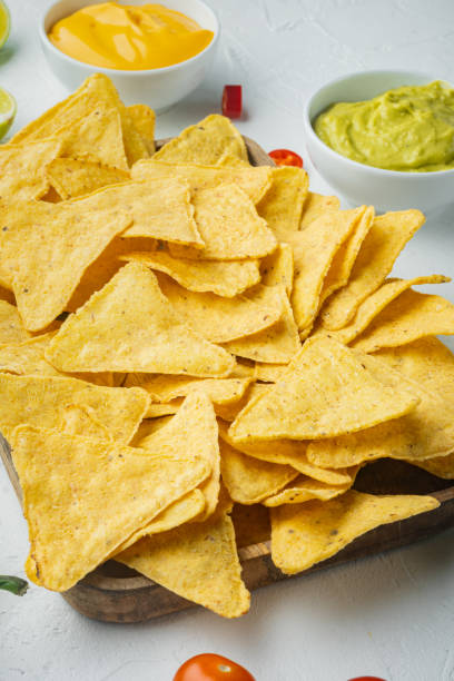 istock Snack for party, chips, nachos with sauces, on white background 1312280975