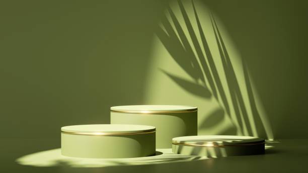 istock 3d render, abstract minimal green background. Empty stage with three cylinder podiums, palm leaf shadow and bright sunlight. Minimal showcase for presentation of organic cosmetic products 1312281187