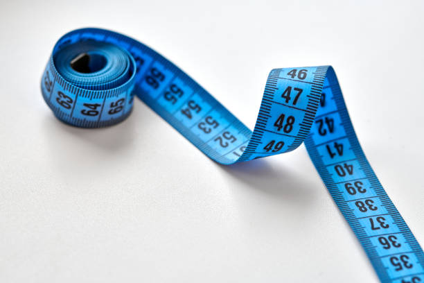 istock Blue measuring tape isolated on white background 1312282949