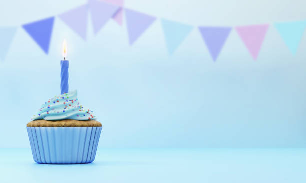 istock Festive cupcake with candle on blue background, 3d rendering. 1312283454