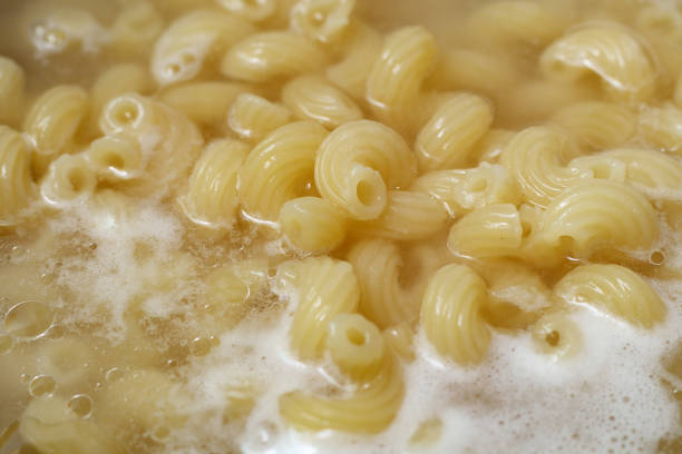 istock Perspective view of cavatappi boiling in water, close up. 1312287976