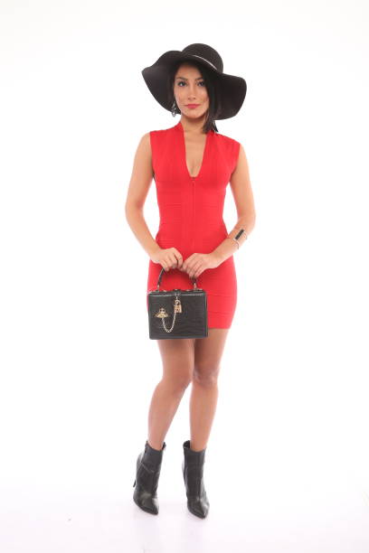 istock woman in red dress 1312288323