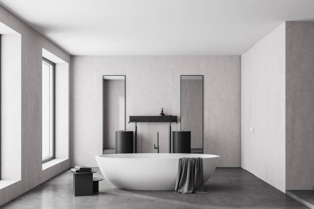 istock Modern bathroom interior with white bathtub and two marble sinks with rectangle vertical mirrors, in eco minimalist style with concrete floor and walls. Panoramic window. No people. 3D Rendering 1312288643