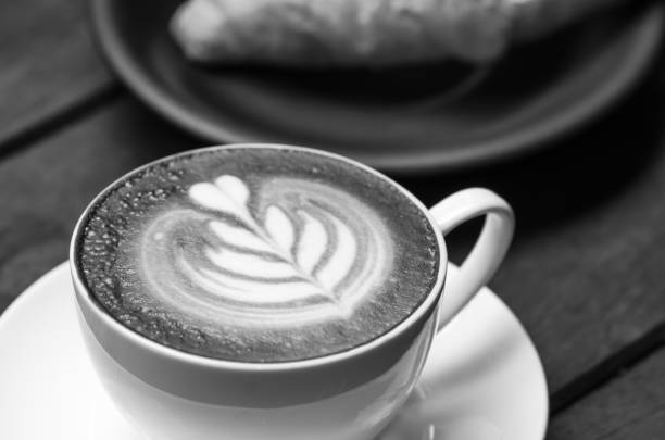 istock Coffee latte with croissant on a wooden table 1312289505