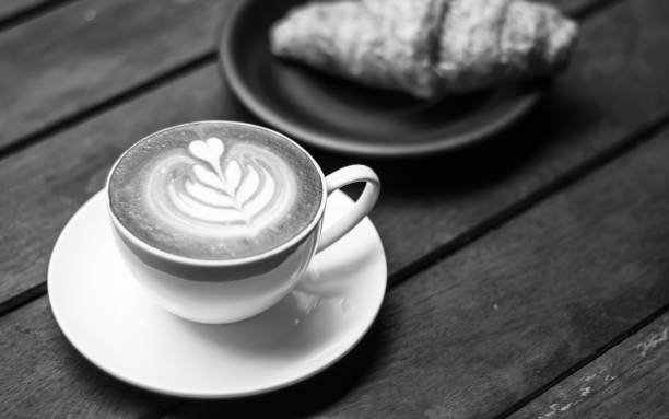 istock Coffee latte with croissant on a wooden table 1312289578