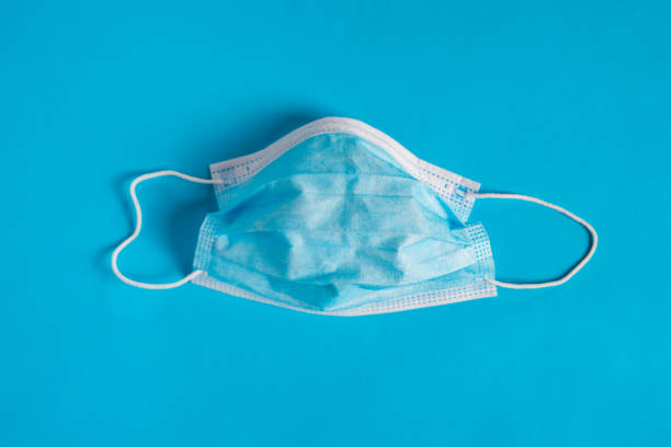 istock An used surgical face mask isolated. 1312289870