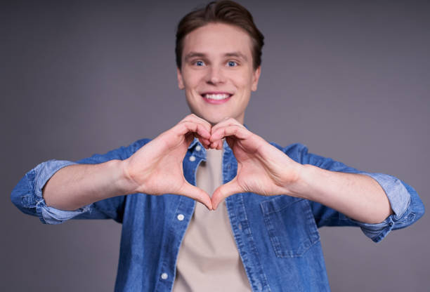 istock Loving cute young guy in a denim shirt. 1312292673