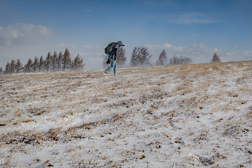 A young photographer in a snowstorm,Primorska, Julian Alps, Slovenia, Europe