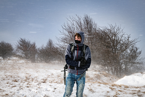 A young photographer in a snowstorm,Primorska, Julian Alps, Slovenia, Europe
