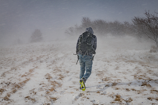 A young photographer in a snowstorm,Primorska, Julian Alps, Slovenia, Europe