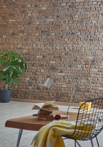 istock modern home interior young room design style with raw brick wall and plant 1312294310