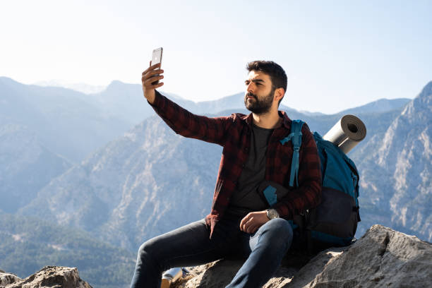 istock Hiker Takes Selfie With Smartphone 1312294552
