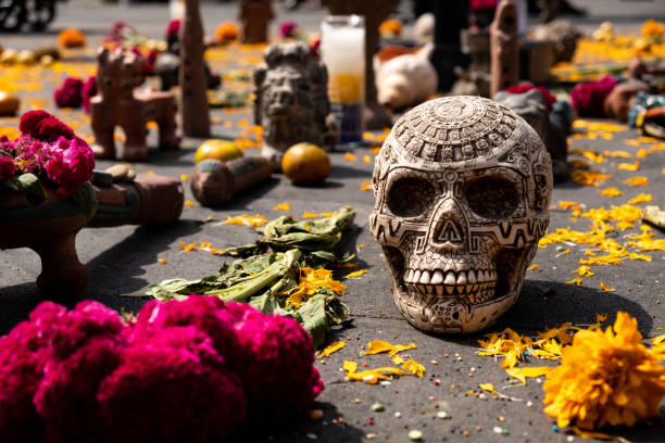 Day of the Dead shrine Day of the dead shrine with skull and marigolds  in the main square of Mexico City (zocalo) shrine stock pictures, royalty-free photos & images