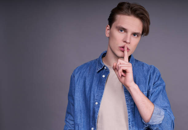 istock Calm young serious caucasian guy in a denim shirt. 1312297323
