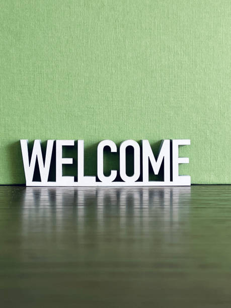 istock Welcome sign on green background 1312298828