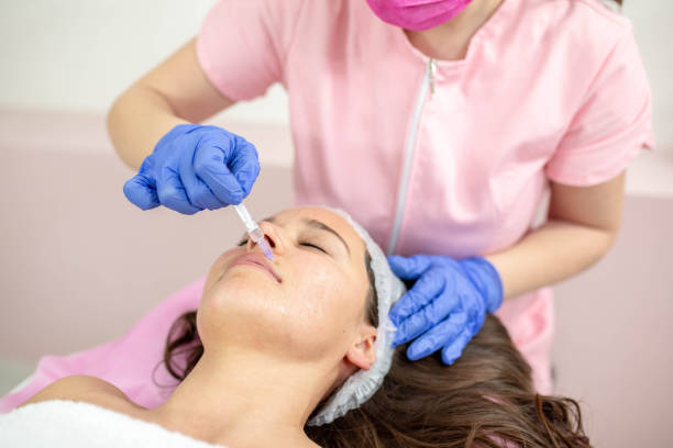 istock Doctor giving an injection into her patients problem area 1312298842